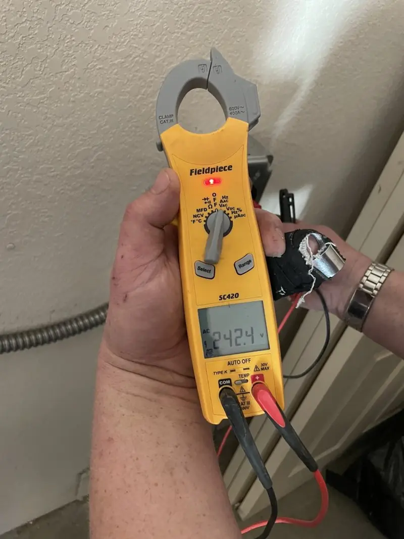 Voltage testing with clamp meter during Outlet Installation in Las Cruces